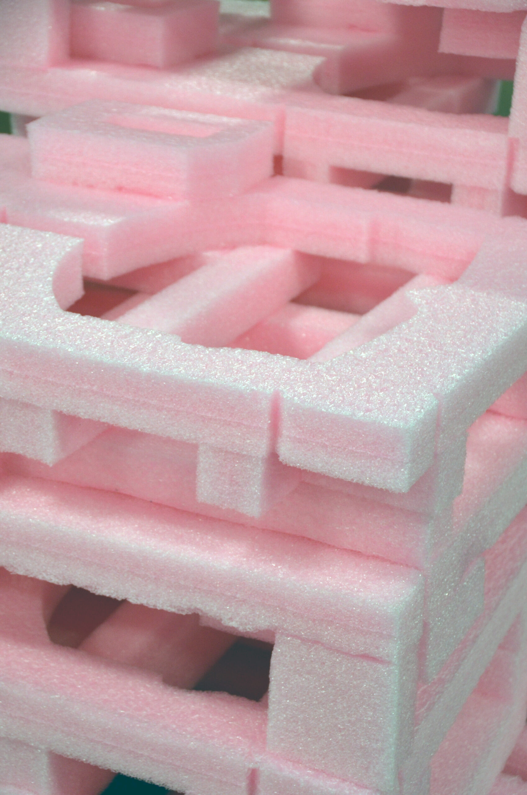 Pink foam inserts designed for protective packaging.